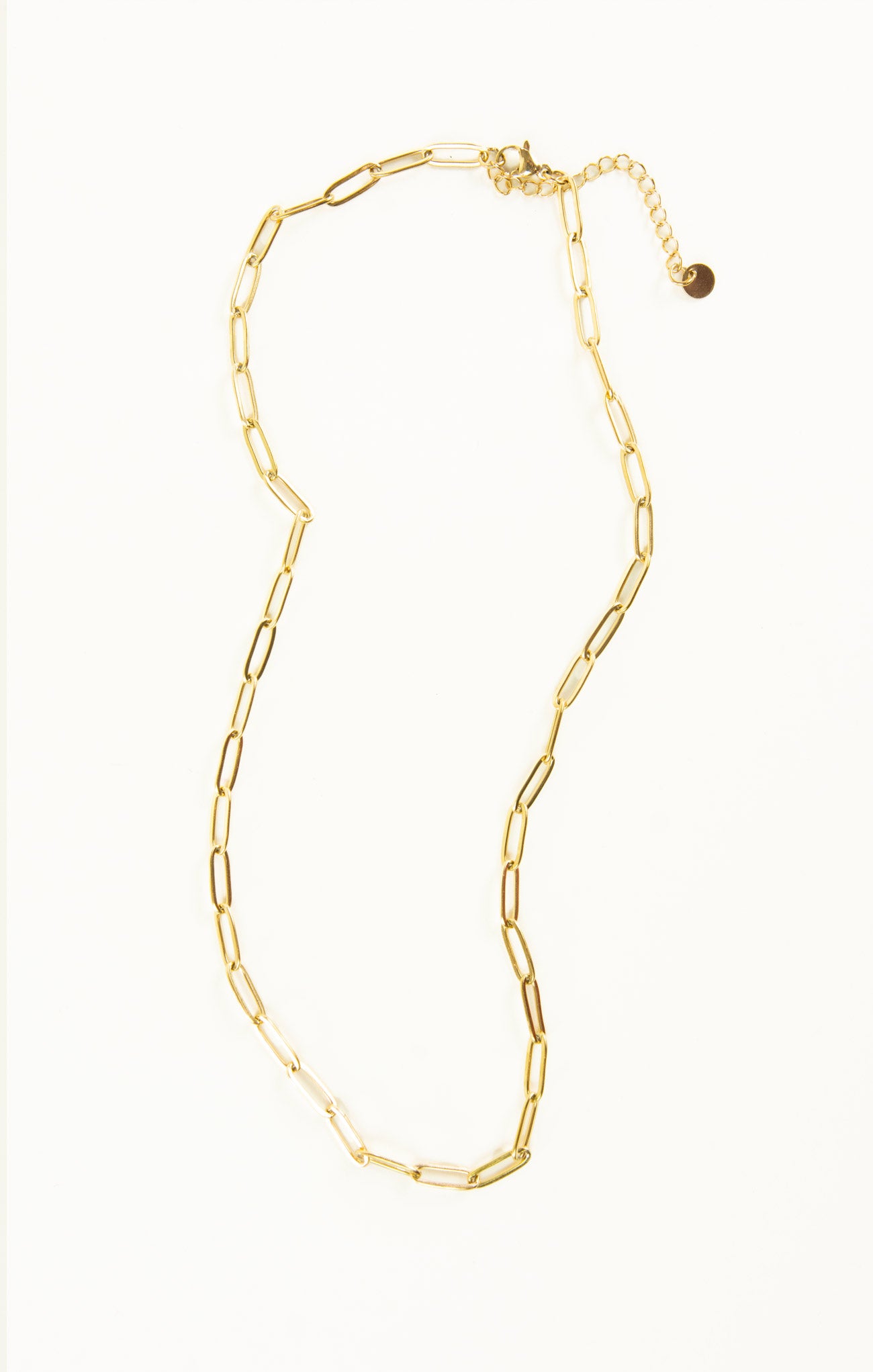Gold chain necklace on a white background