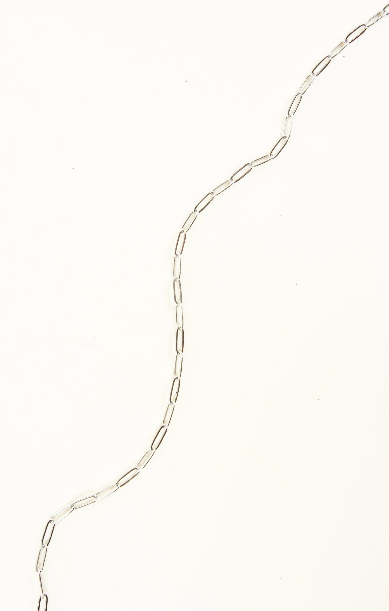 Silver chain necklace on a white background