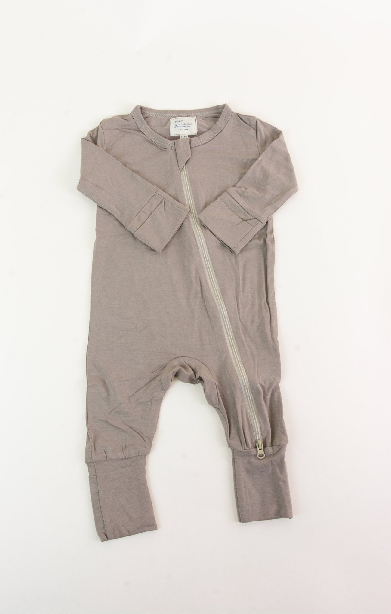 Brown baby romper with a zipper on a white background