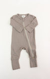 Brown baby romper with a zipper on a white background