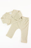 Beige baby outfit with shirt and pants on a white background