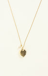 Gold necklace with a geometric pendant on a white background