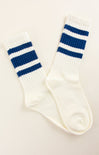 White socks with blue stripes on a beige background