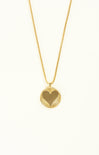 Gold heart-shaped pendant necklace on a white background