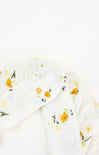 Floral patterned fabric with yellow flowers on a white background