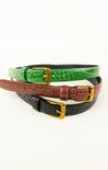 Three belts in green, brown, and black with gold buckles on a white background