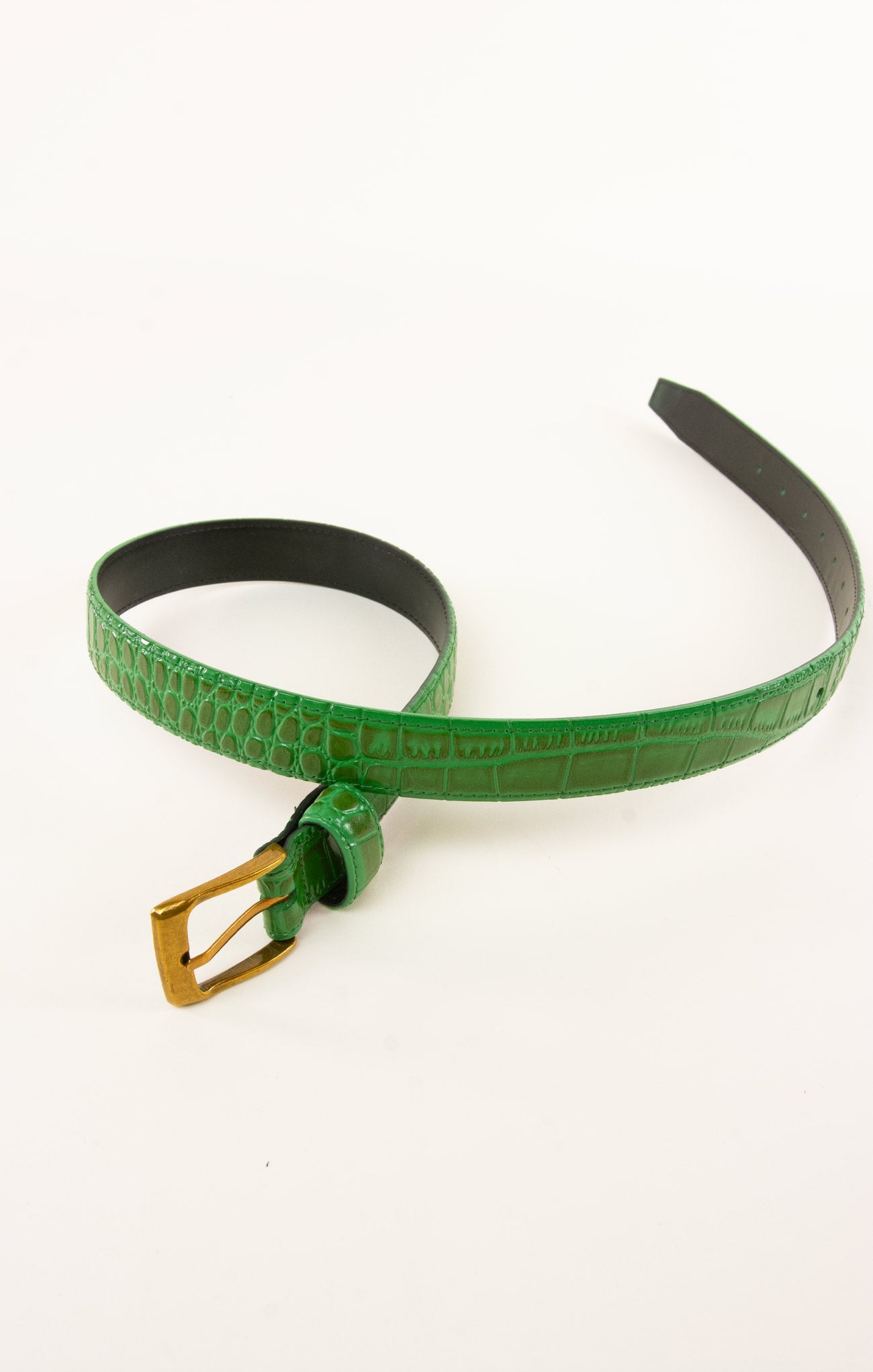 Green belt with a gold buckle on a white background