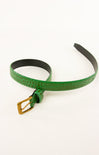 Green belt with a gold buckle on a white background