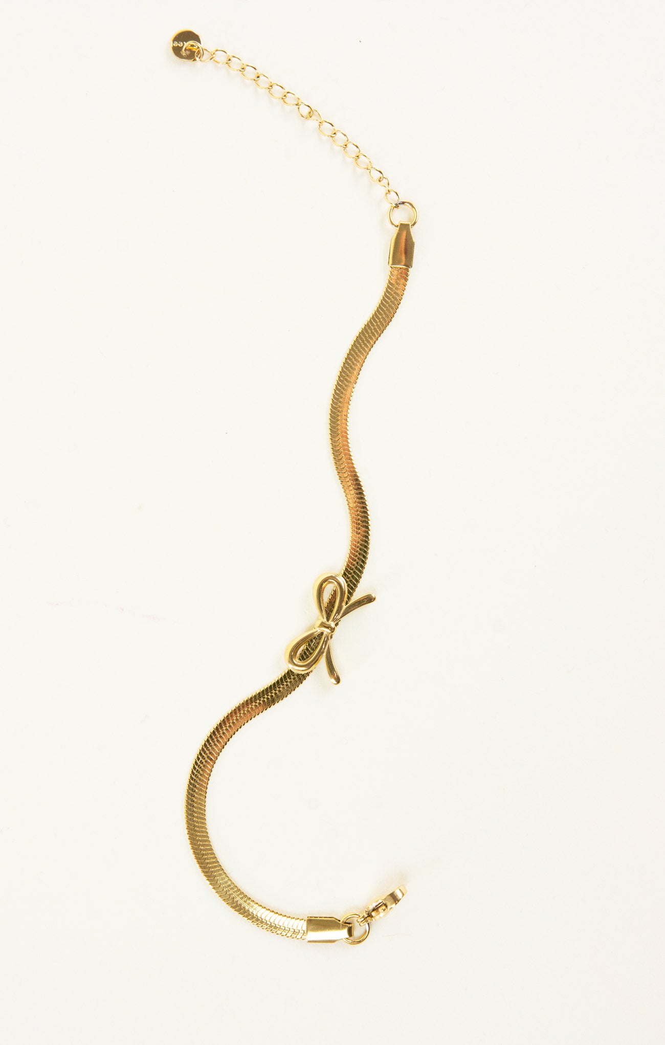 Gold snake necklaces on a white background