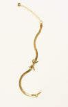 Gold snake necklaces on a white background