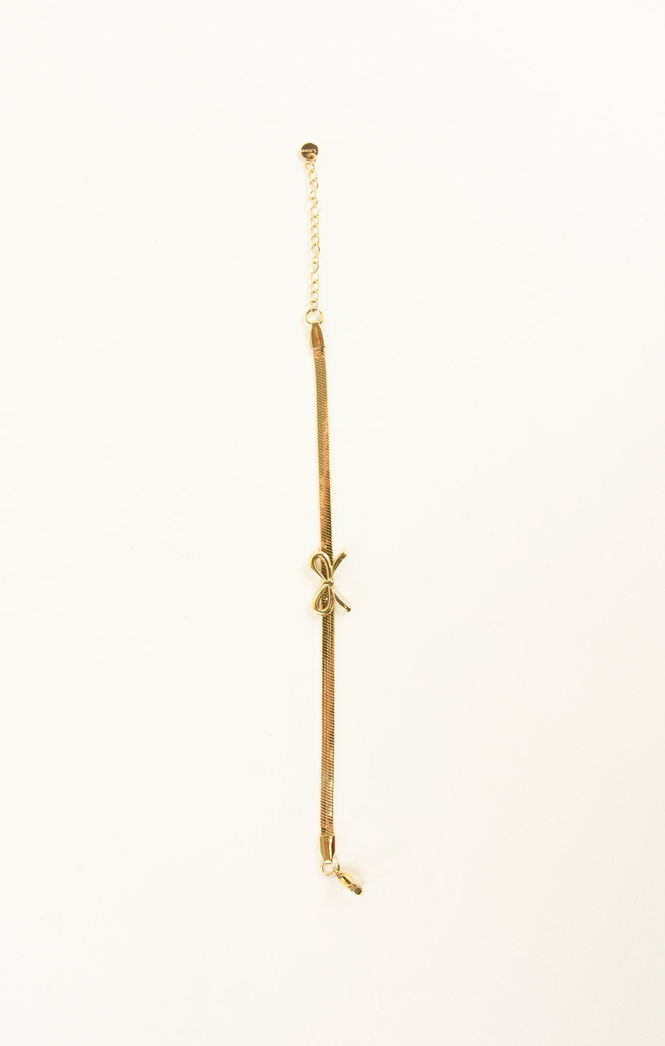 Gold anklet on a white background