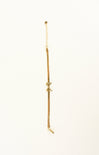 Gold anklet on a white background