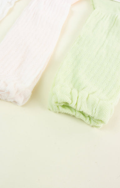 Light green fabric on a light beige surface