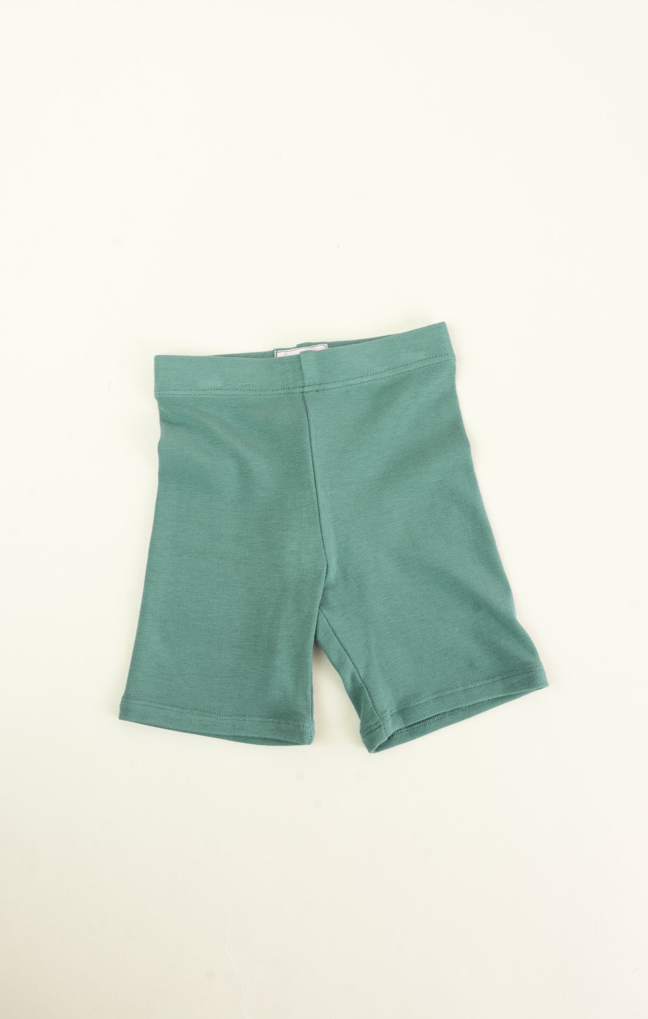Green shorts on a white background