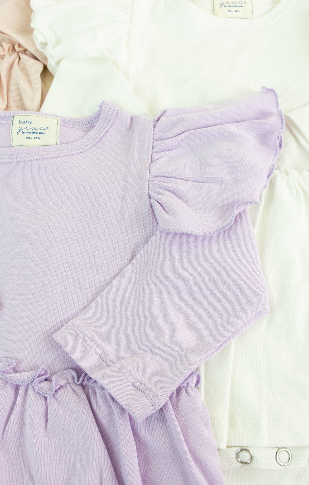 Lavender dress with ruffled sleeves on a white background