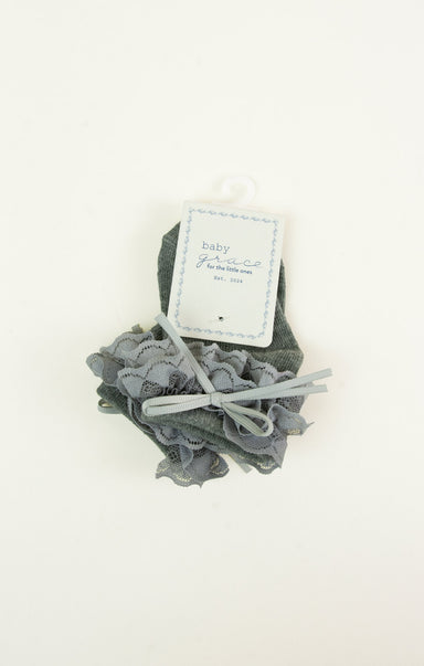 Gray baby booties with a matching headband on a white background