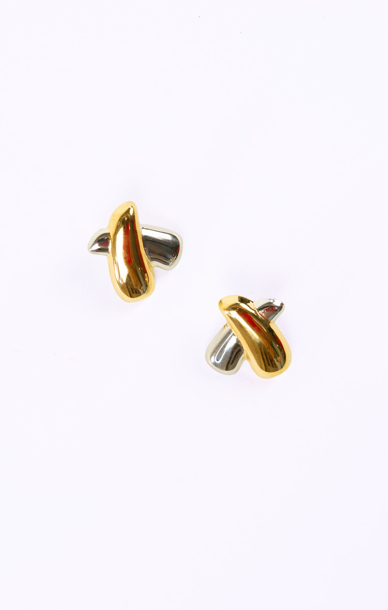 Pair of gold earrings on a white background