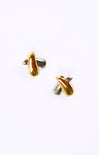 Pair of gold earrings on a white background