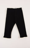 Black pants with lace trim on a white background