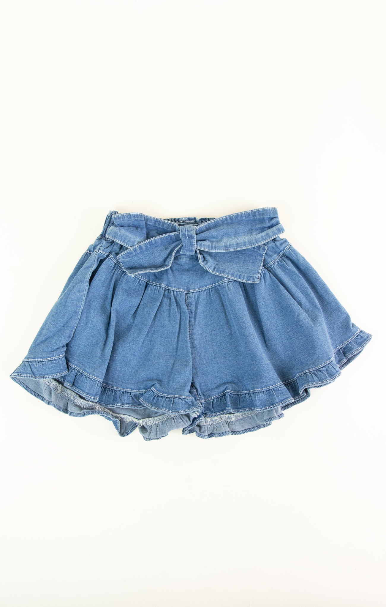 Blue denim skirt with a bow on a white background