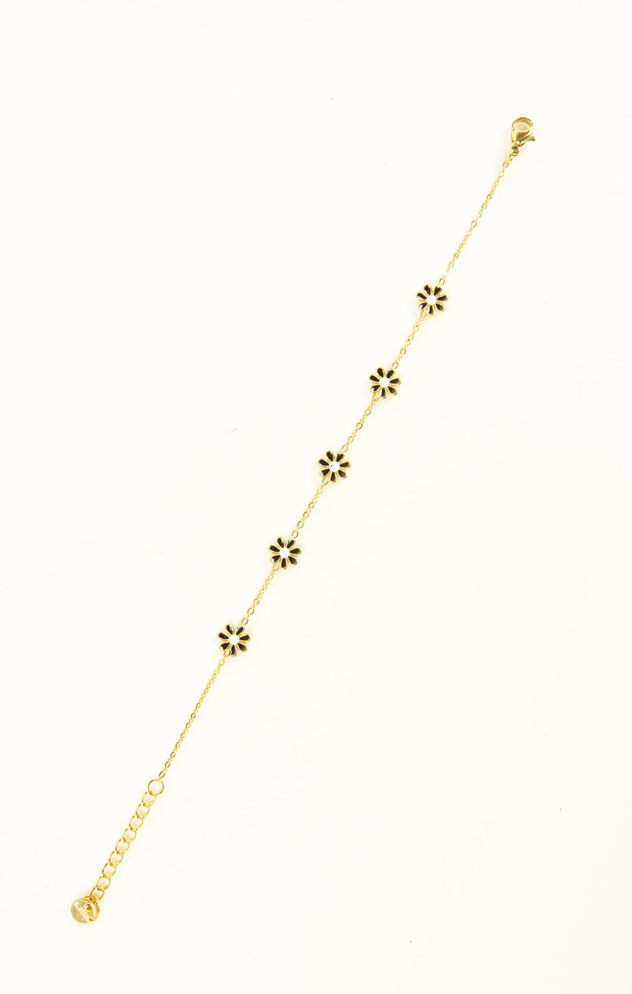 Gold necklace with floral pendants on a white background