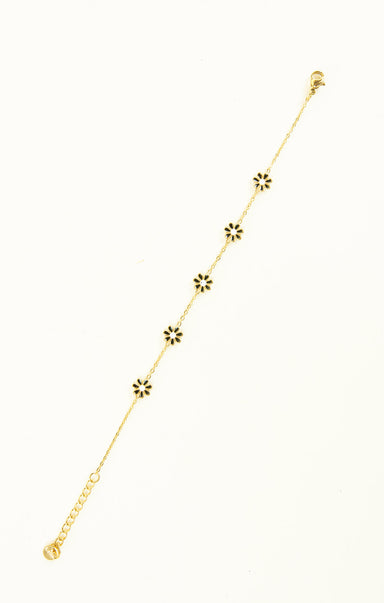 Gold necklace with floral pendants on a white background