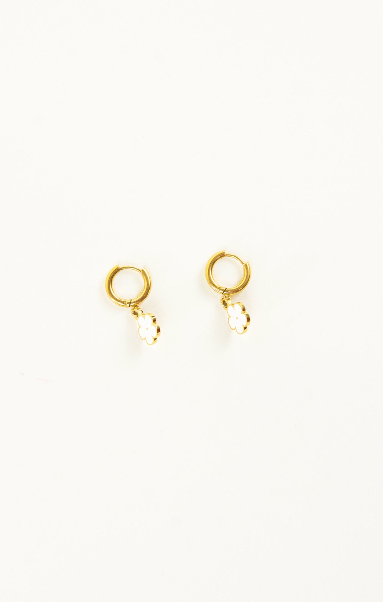 Gold hoop earrings on a white background