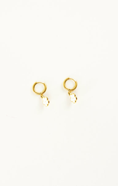 Gold hoop earrings on a white background