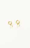 Gold hoop earrings on a white background