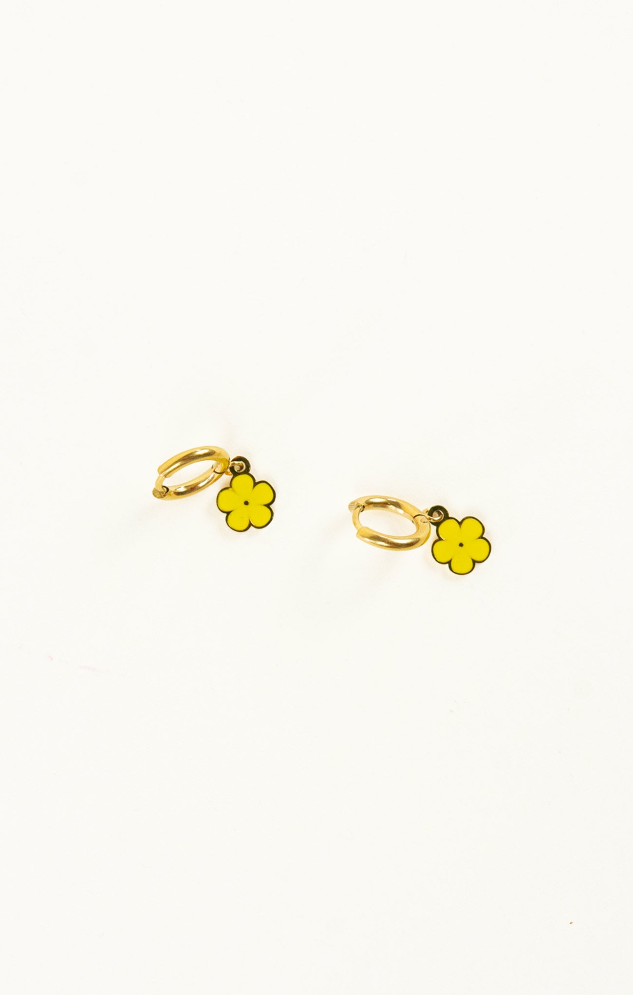 Gold flower-shaped earrings on a white background