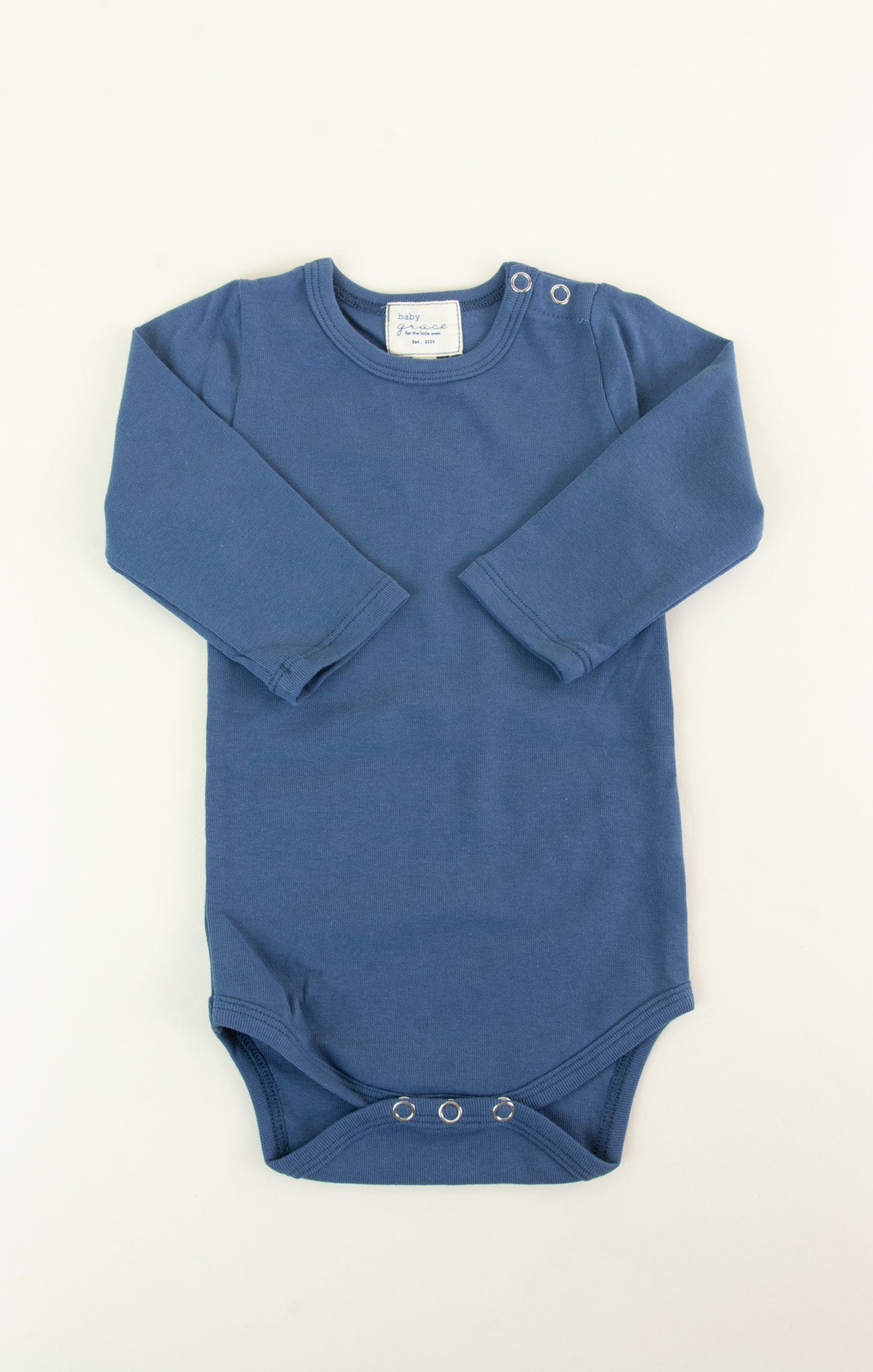 Blue baby onesie with long sleeves on a white background