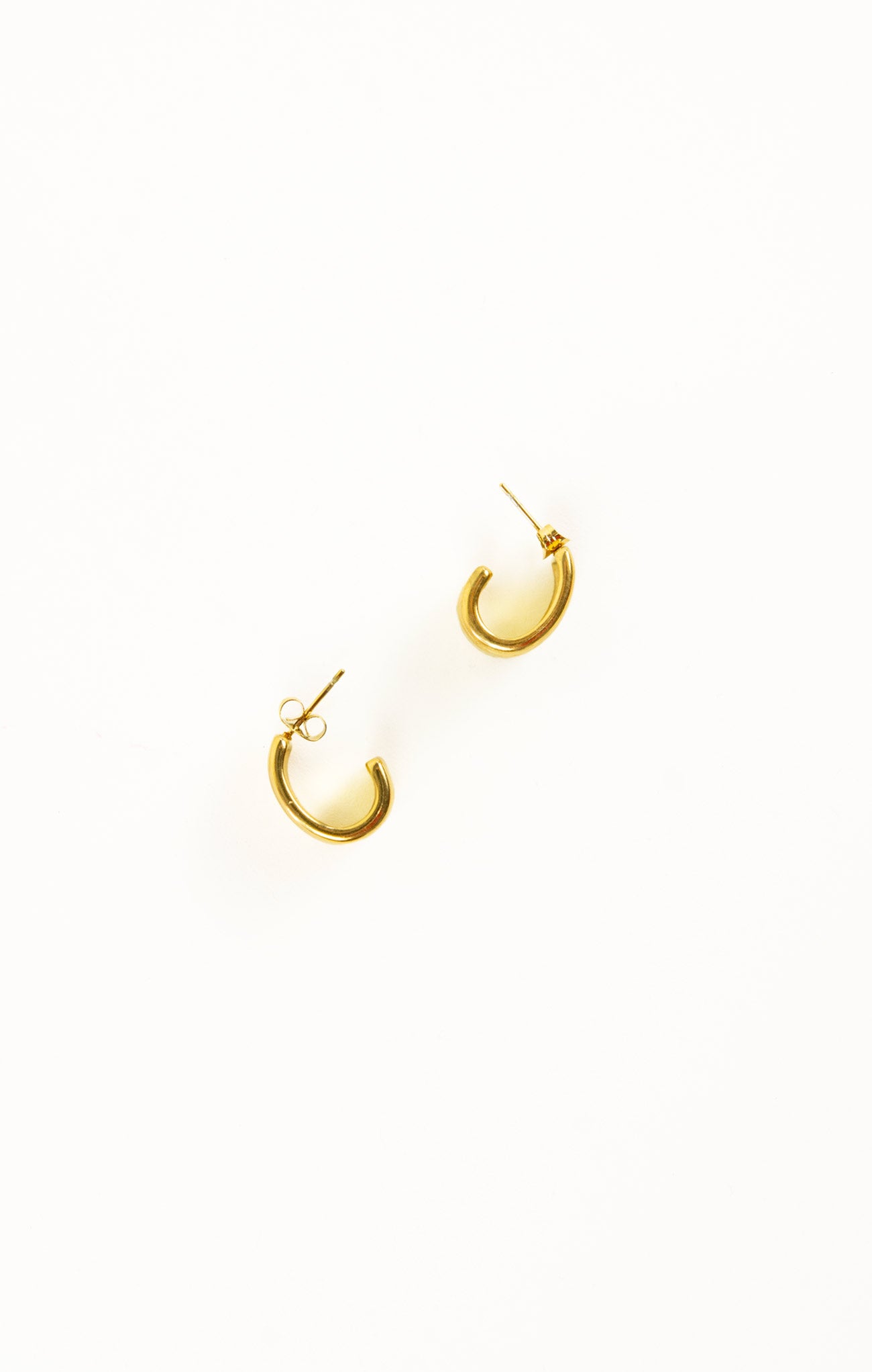 Gold hoop earrings on a white background