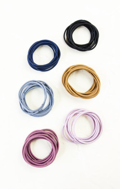 Set of colorful hair ties on a white background