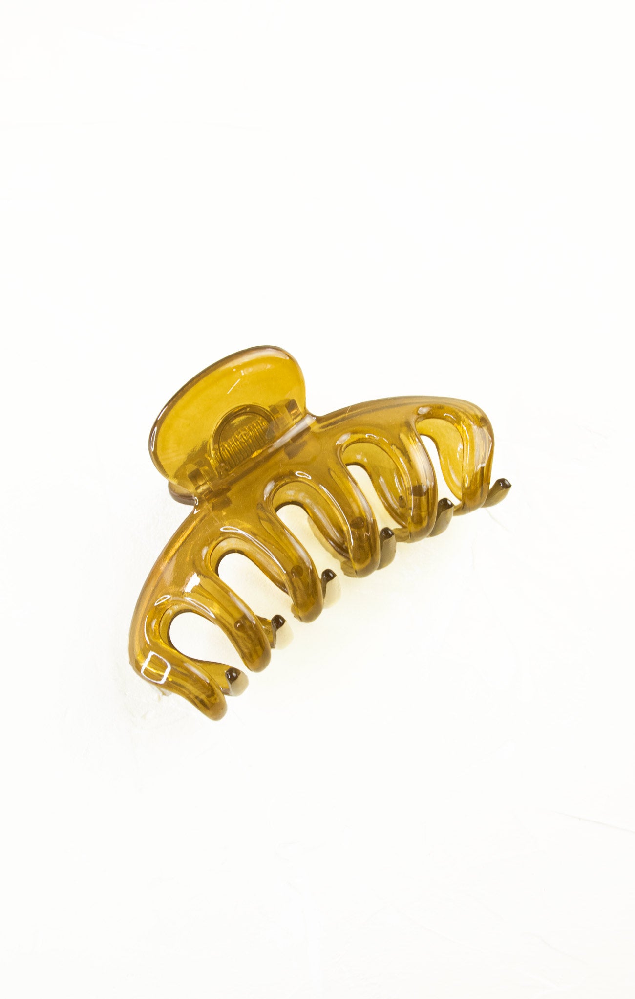 Yellow hair clip on a white background