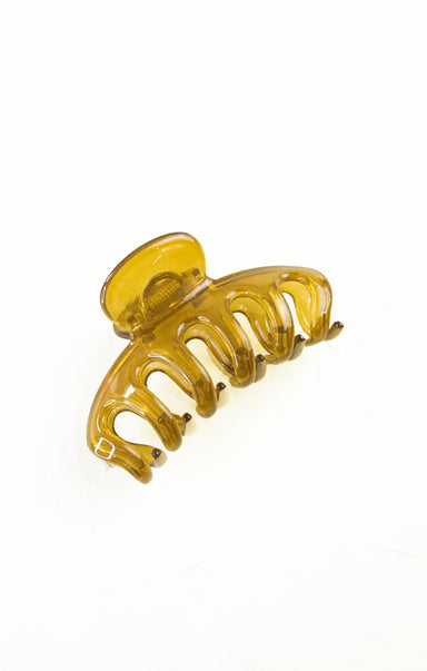 Yellow hair clip on a white background